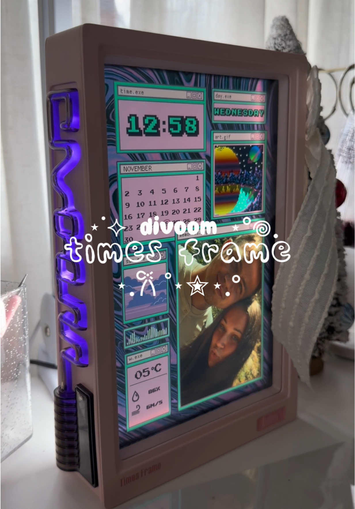 TikTok post by @klocaff for Divoom. Caption reads: divoom times frame by @Divoom ✨ hands [...].