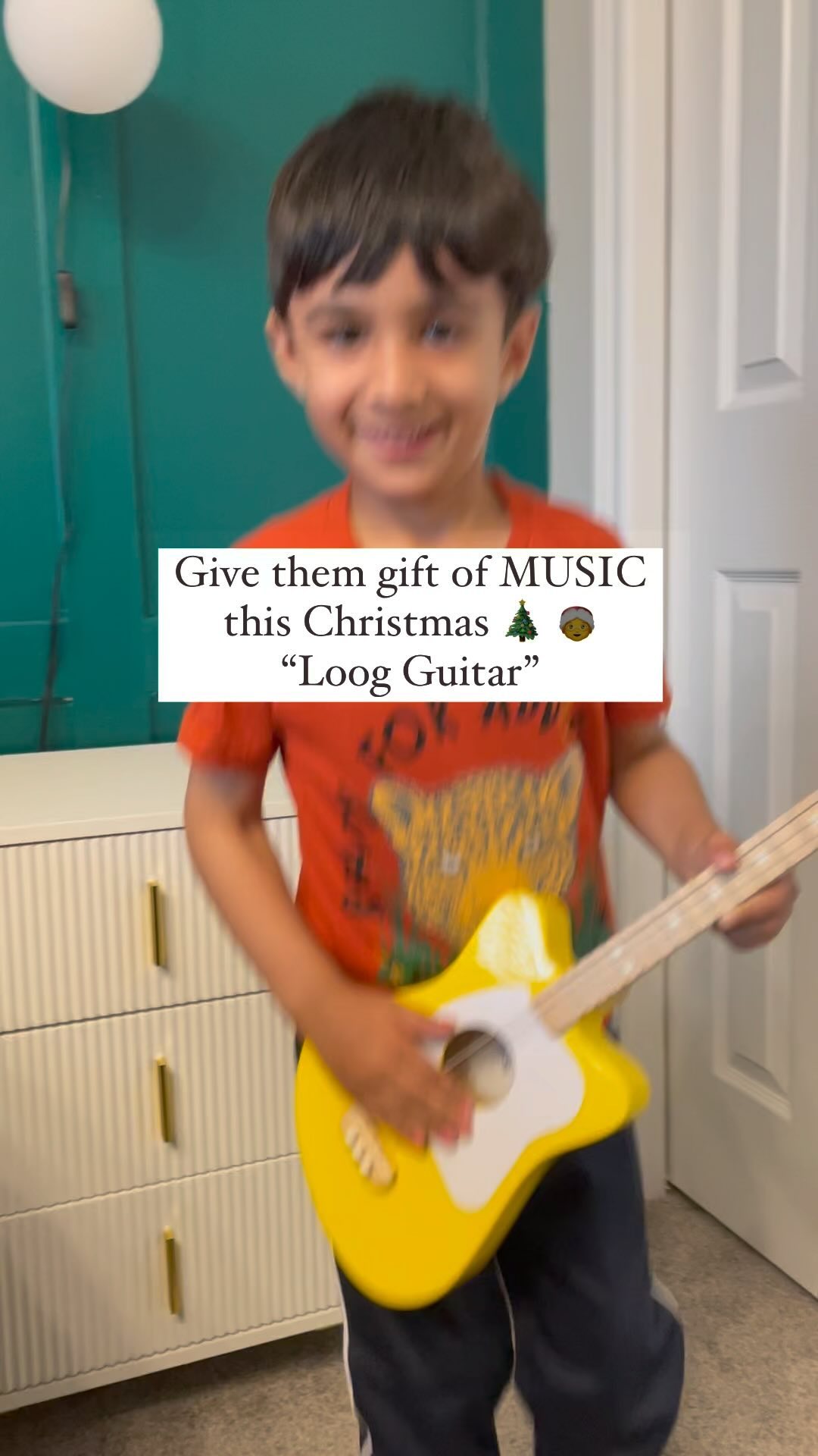 Instagram post by @happyvihaanmalhotra for Loog Guitars. Caption reads: [...] phase of his new guitar from @loogguitars....