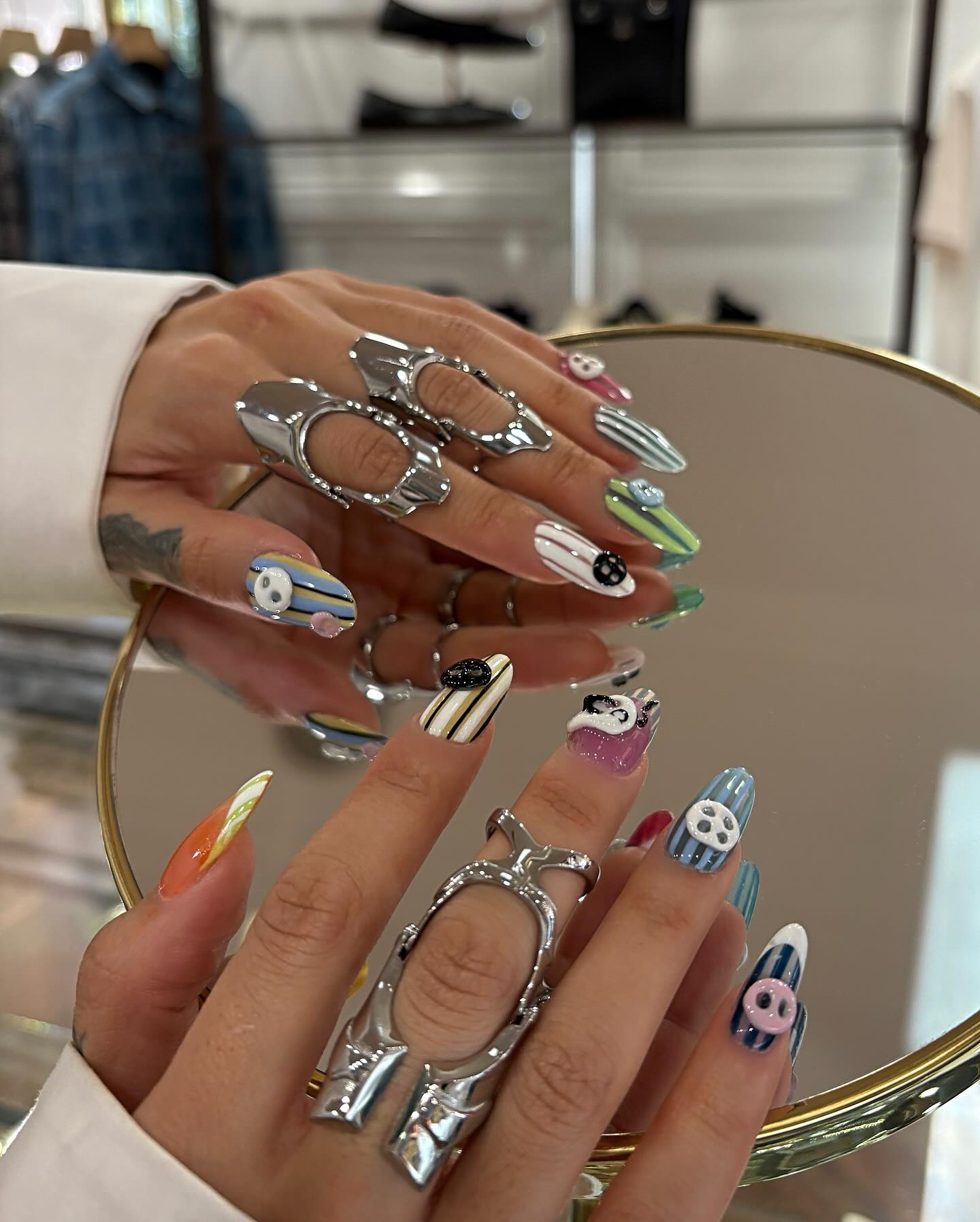 Instagram post by @cocamichelle for Wella. Caption reads: Pulled up to the @opi lab with my button & stripes....