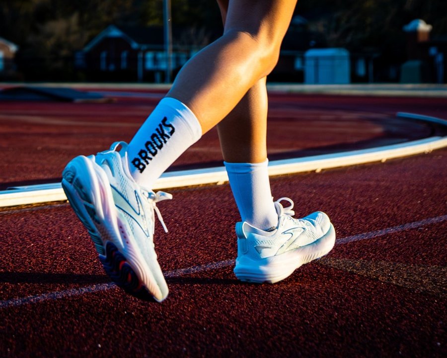 Instagram post by @empierce for 98Strong. Caption reads: One pair. All the places. The Brooks Glycerin 22....