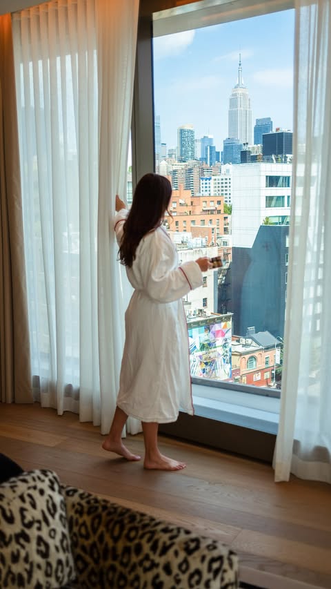 Instagram post by @reneeroaming for Capital One. Caption reads: Dream NYC stay! #CapitalOnePartner Staying at a....