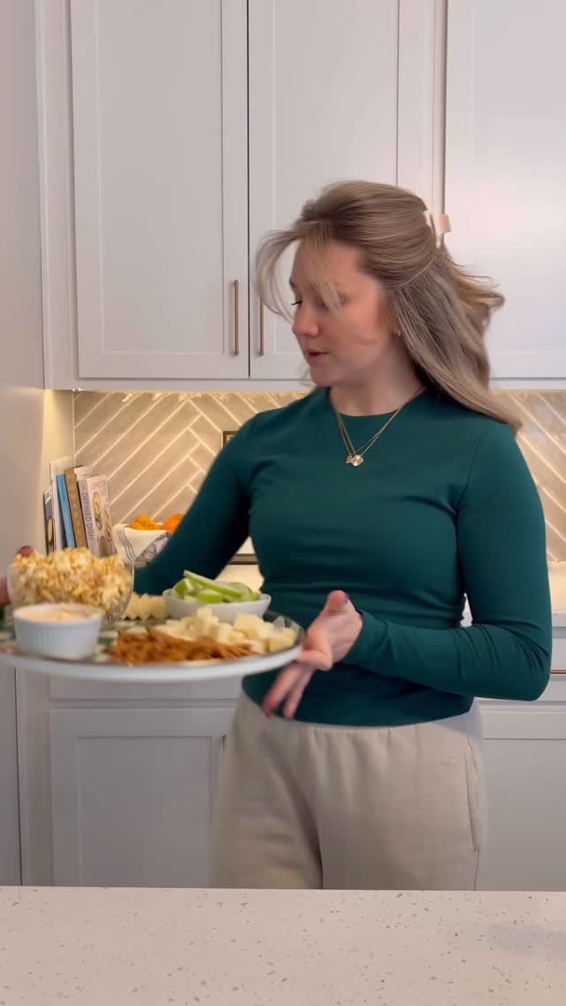 Instagram post by @megslifebelike for LesserEvil. Caption reads: [...] tried the new #buffalopopcorn from....