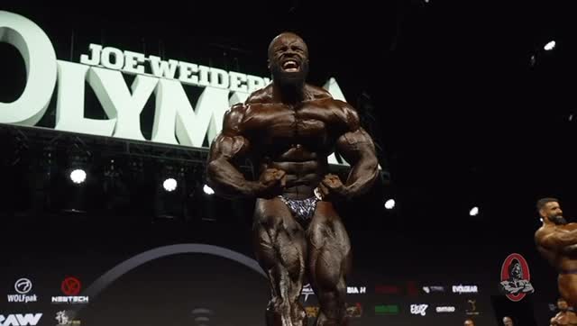 Instagram post by @jake_wood_media for FLEX Magazine. Caption reads: 2025 Olympia Weekend! 

Watch all the action at....