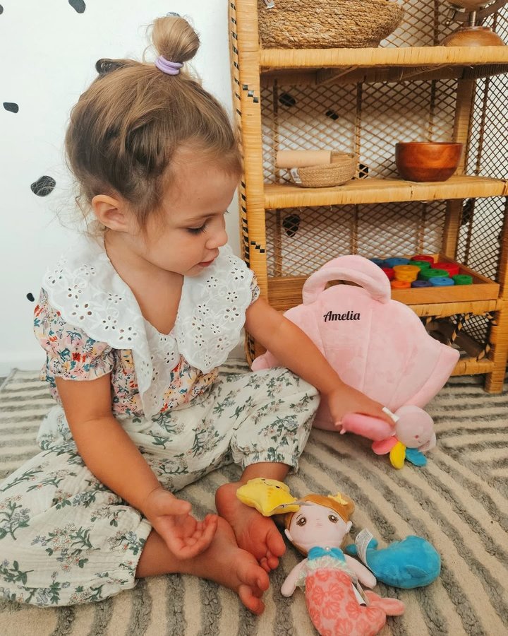 Instagram post by an influencer for OUOZZZ. Caption reads: [...] Bag Sensory Toy Set from @ouozzz_shop....