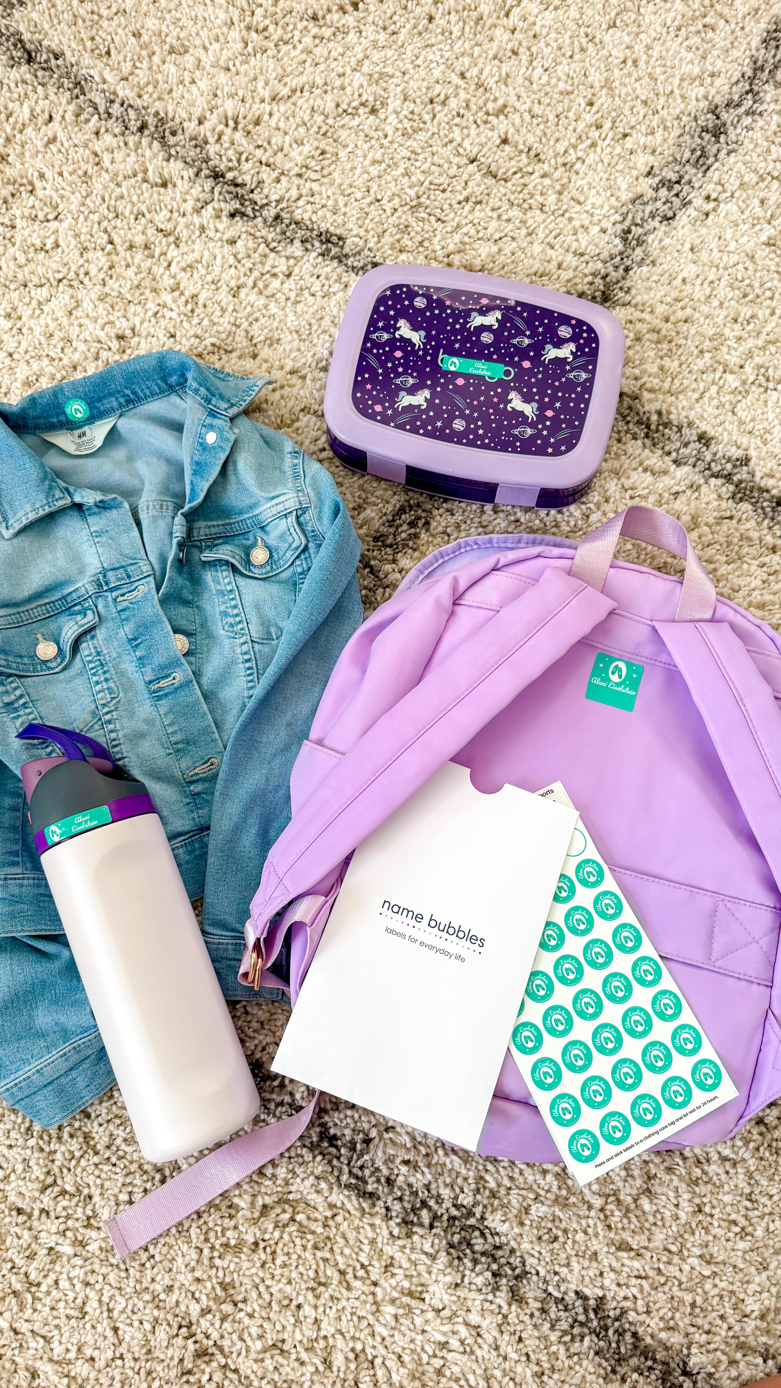 Instagram post by @raising.wolves_ for Name Bubbles. Caption reads: We don’t head back to school without @namebubbles.....