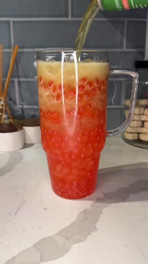 Instagram post by @ashleymarkletreats for Huel. Caption reads: this strawberry boba greens refresher was the....