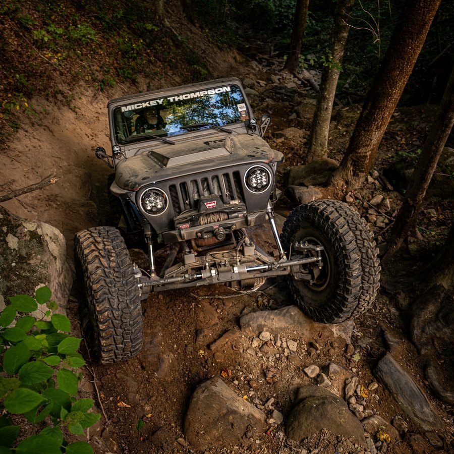 Instagram post by @recoil_tj for Motobilt. Caption reads: The trails in West Virginia are underrated, change....