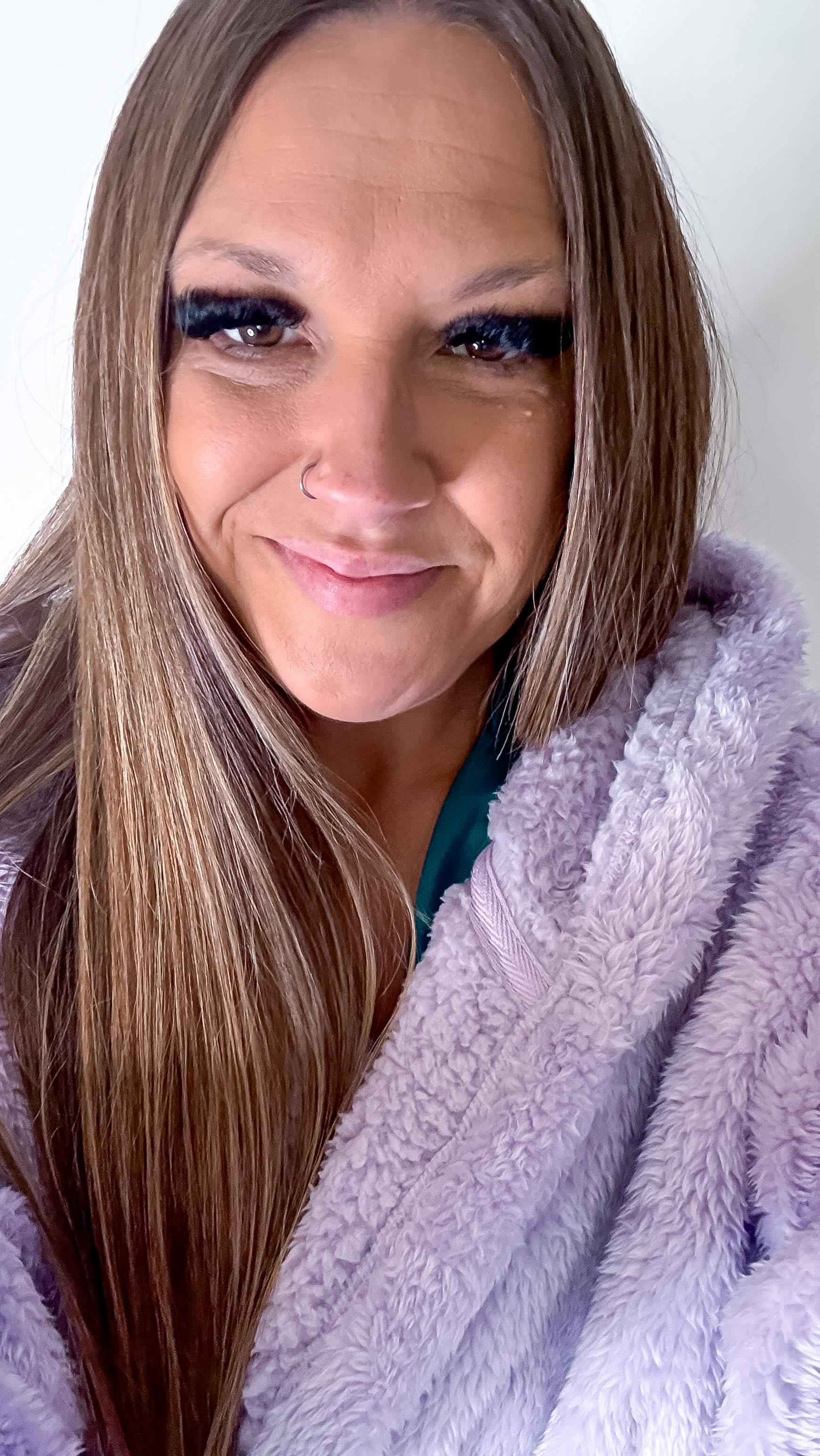 Instagram post by @__ariana__x.x for The Oodie. Caption reads: Check out my brand new fluffy dressing gown from....