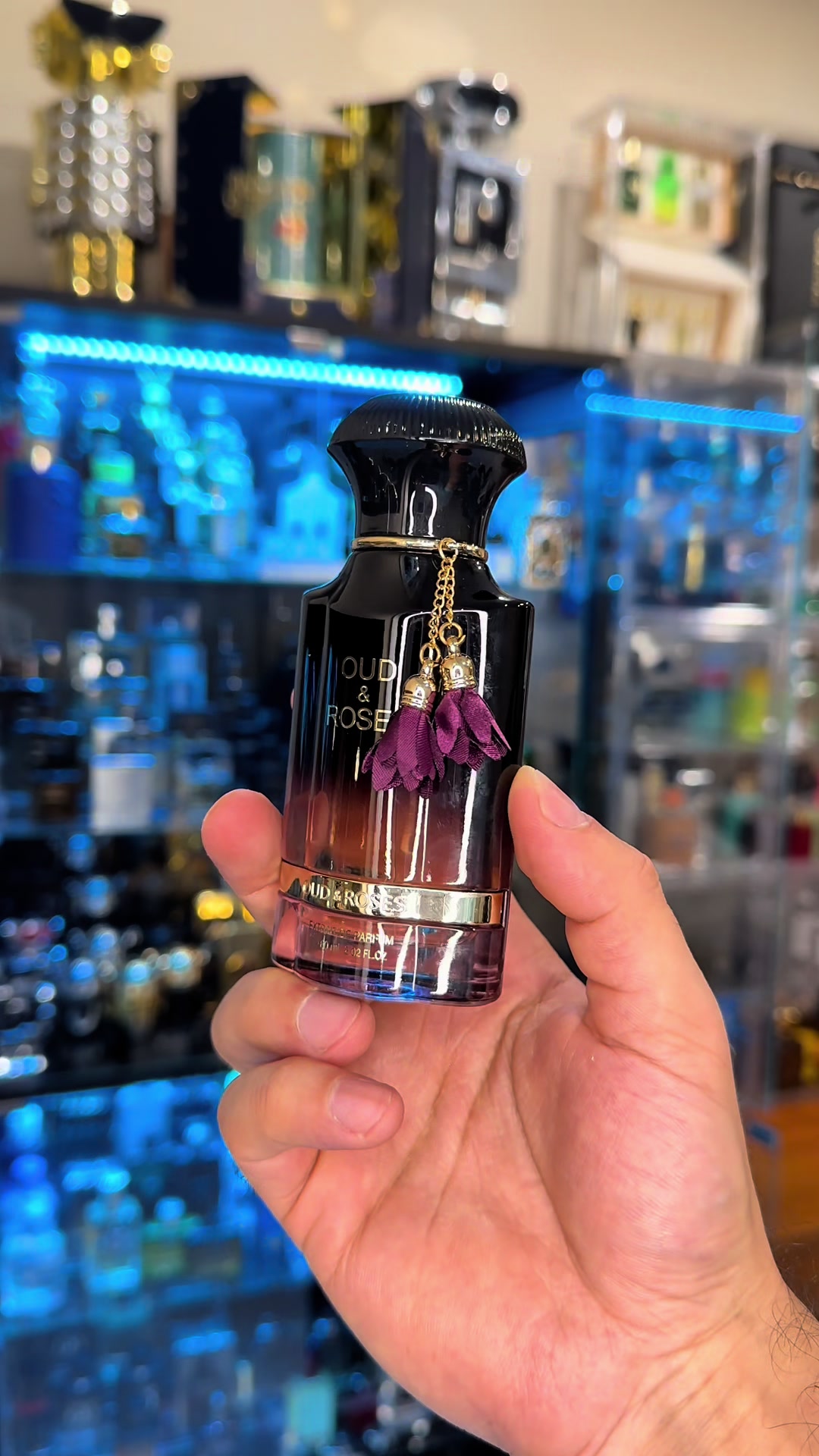 TikTok post by @fahoodyfragrance for PerfumeboxUSA. Caption reads: [...] and Roses by Ahmed Al Maghribi 🌹🪵....