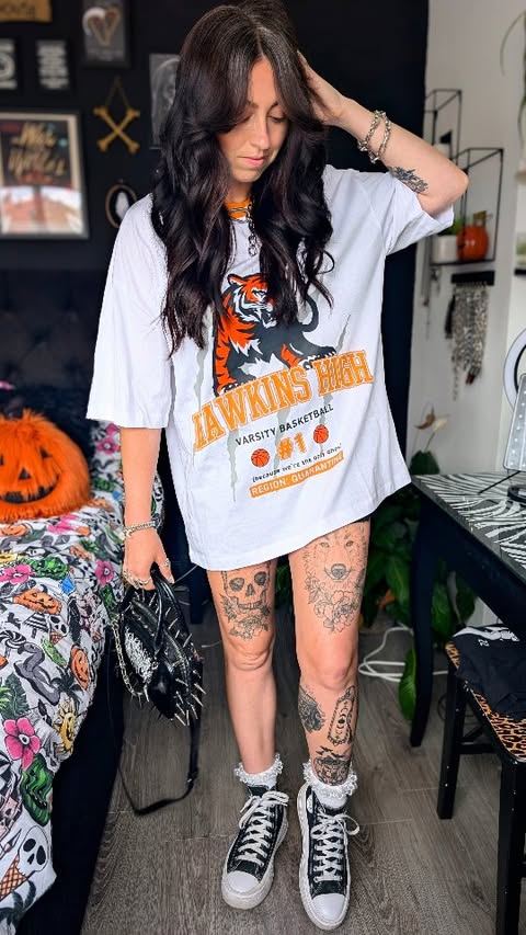 Instagram post by @spookylittlelair for REGALROSE.com. Caption reads: Me 🤝🏼 oversized tees & tiny skirts Happy....