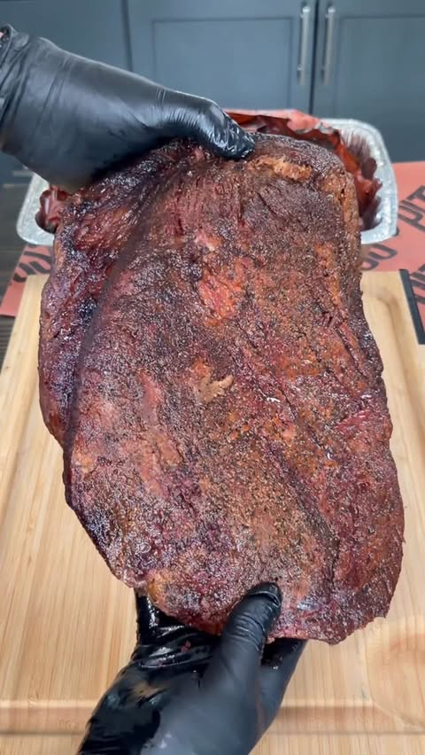 Instagram post by @grillnation for Pit Boss Grills. Caption reads: [...] 🔥 Ran this one low and slow on the....