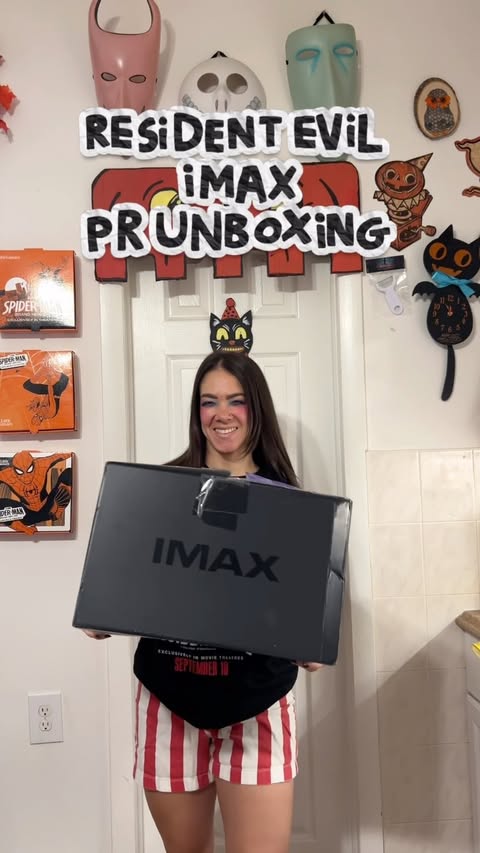 Instagram post by @whatpaigeisit for IMAX. Caption reads: RESIDENT EVIL PR UNBOXING WITH IMAX😱 RESIDENT....