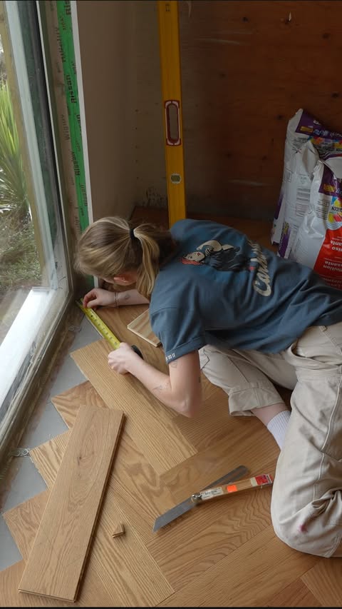 Instagram post by @jennaphipps for Carhartt. Caption reads: [...] of renovating our abandoned home and....