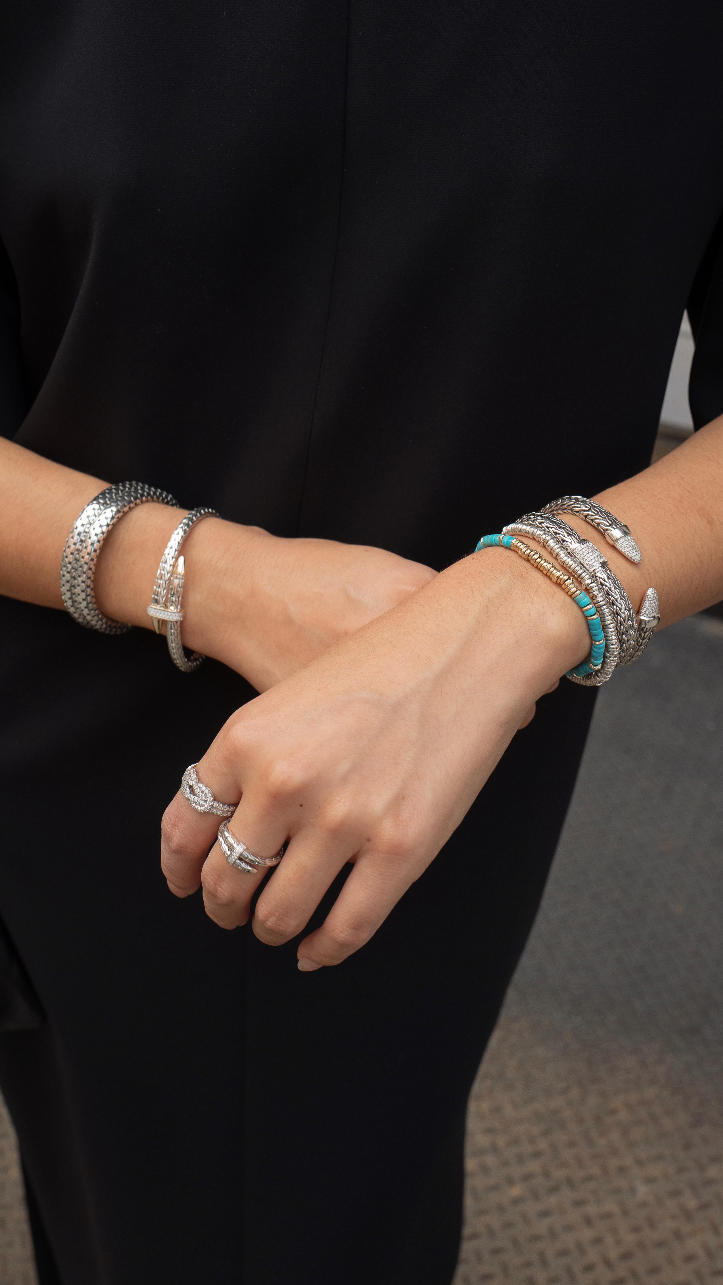 Instagram post by @laurajung for John Hardy. Caption reads: More is more!! Elevating an otherwise simple black....