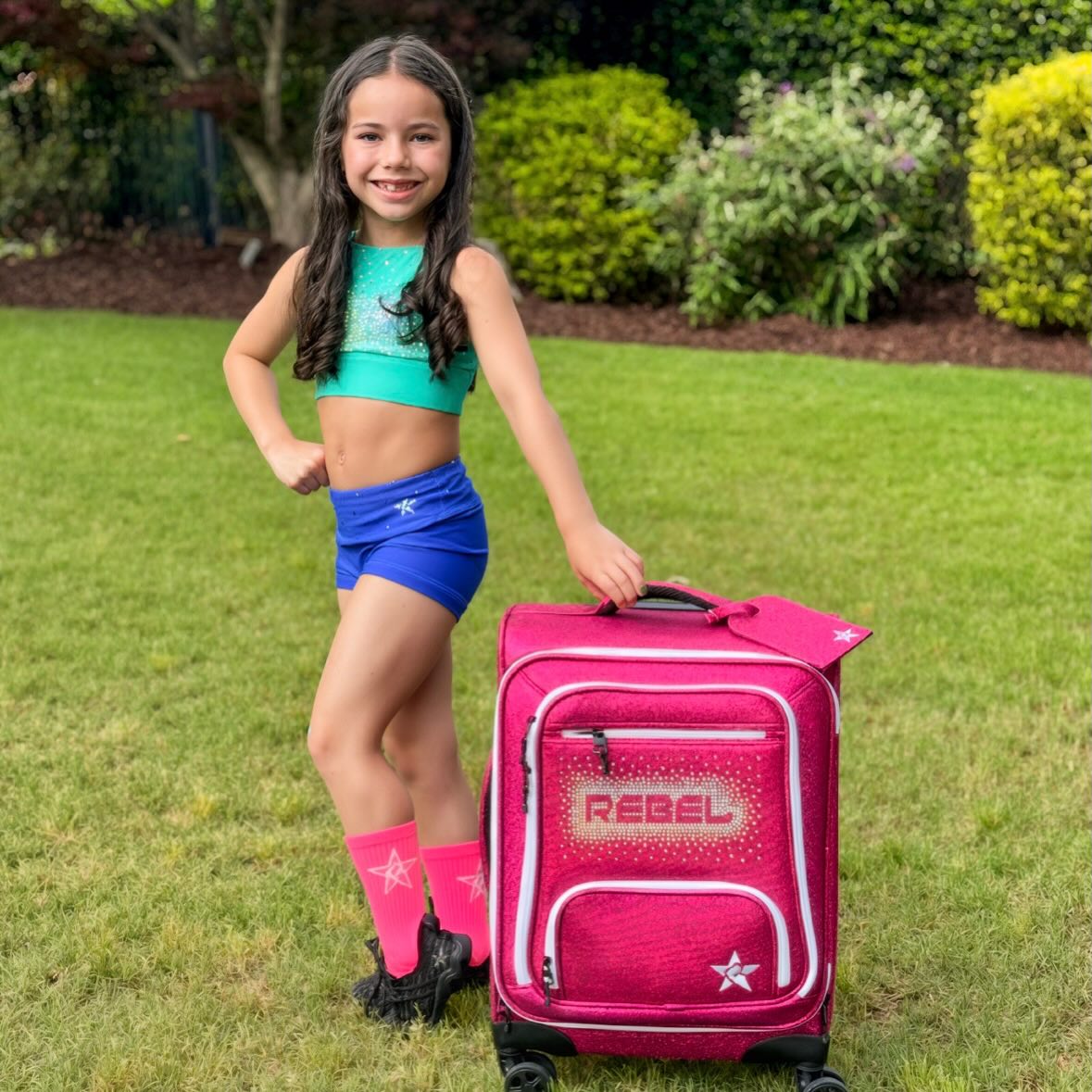 Instagram post by @aubreebedoya for Rebel Athletic. Caption reads: [...] week so I can come cheer you on! 💖....