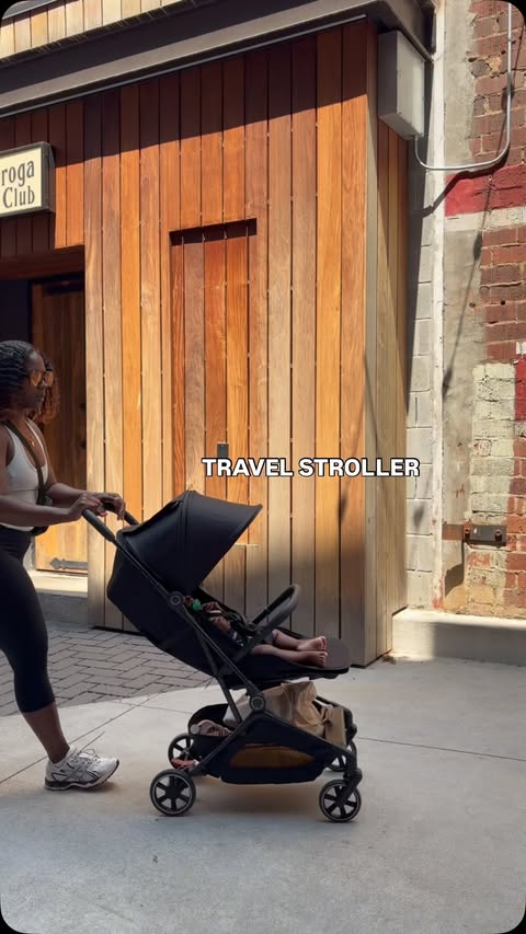 Instagram post by @tykastin for Momcozy. Caption reads: NEW GOODIES: Travel stroller from @momcozy 🤭 It’s....