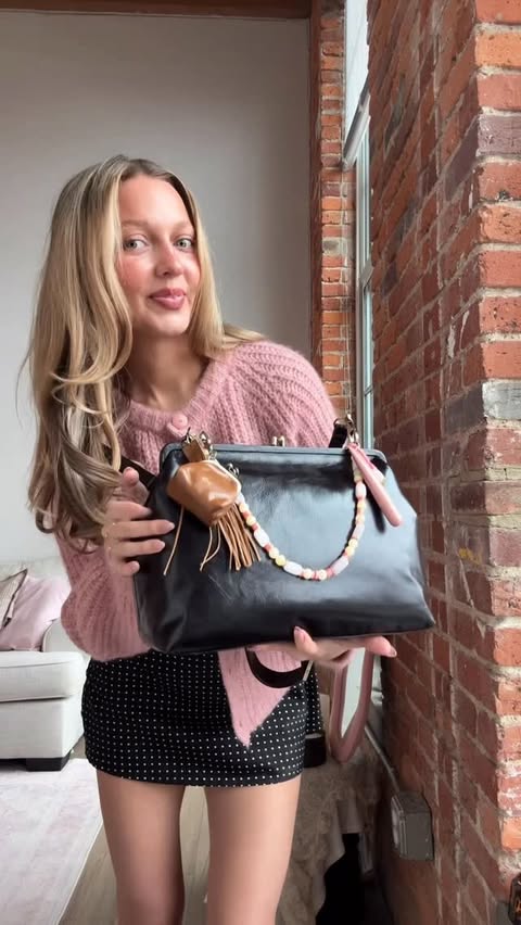 Instagram post by @jennibrhodes for HOBO. Caption reads: one bag that does it all 👛 @hobotheoriginal Alba!....