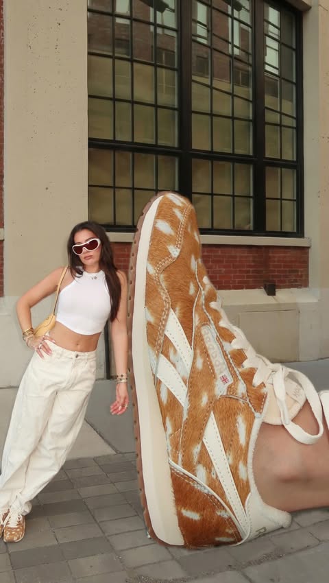 Instagram post by @kay_caputo for Reebok. Caption reads: [...] that get it, get it🦌🤭🧡 @reebok x @dsw #ad....