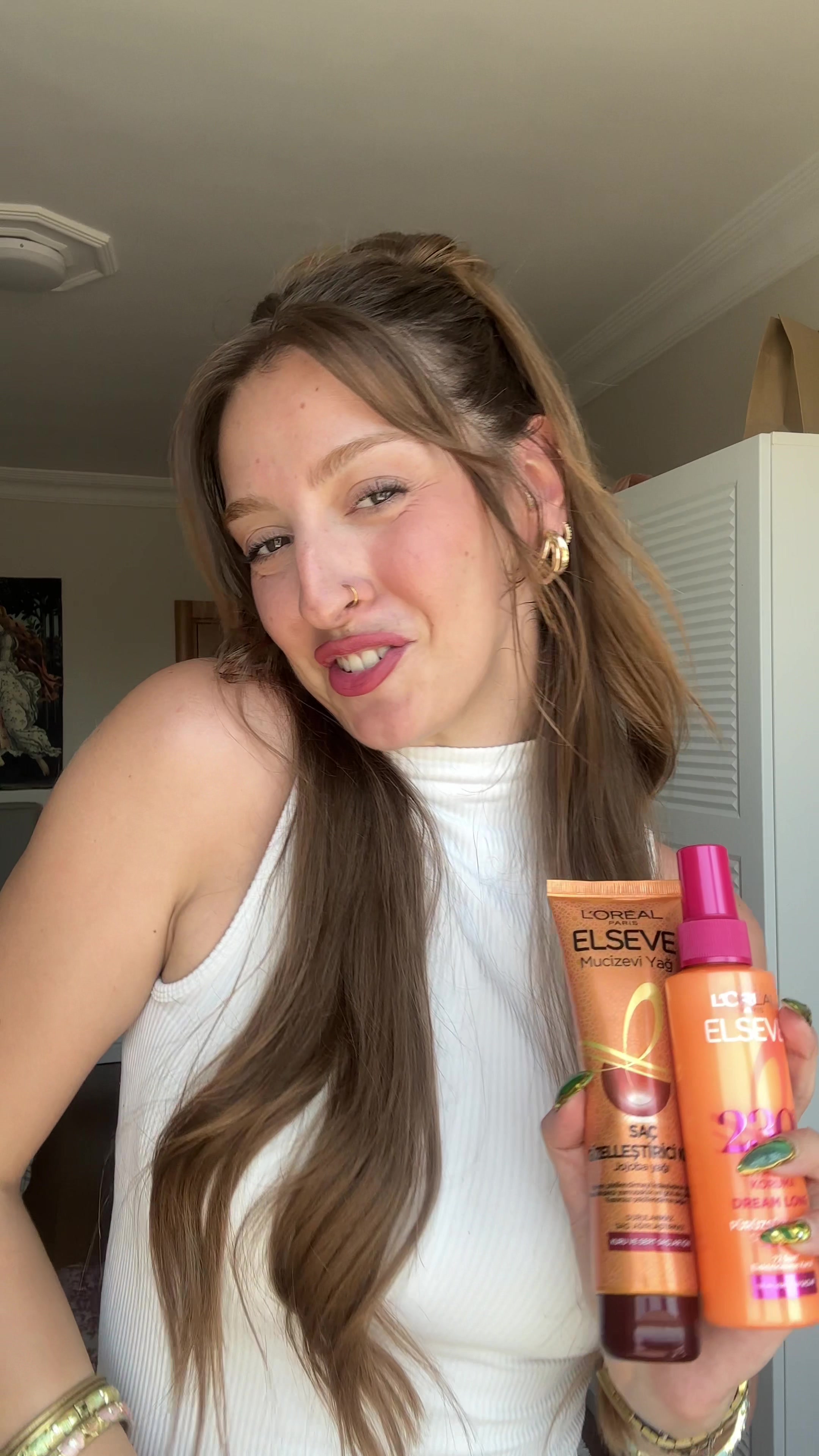 TikTok post by @zeynepozyilmaaaz for L'Oreal Paris. Caption reads: Ben bu saç modeline gerçekten bayıldımm! 🧡Siz de....