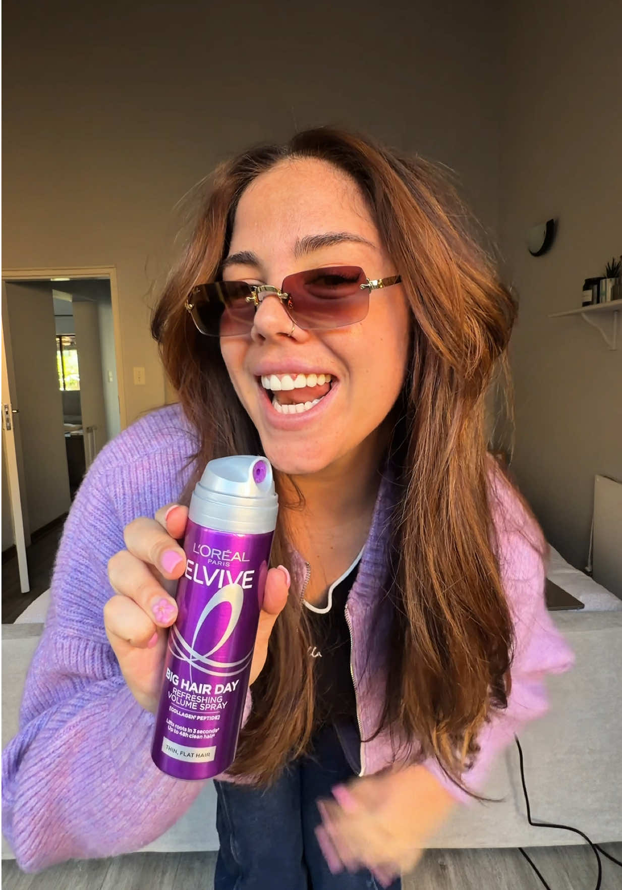 TikTok post by @thecitymakoti for L'Oréal Paris South Africa. Caption reads: Flat hair days are officially over. 💜 The new....
