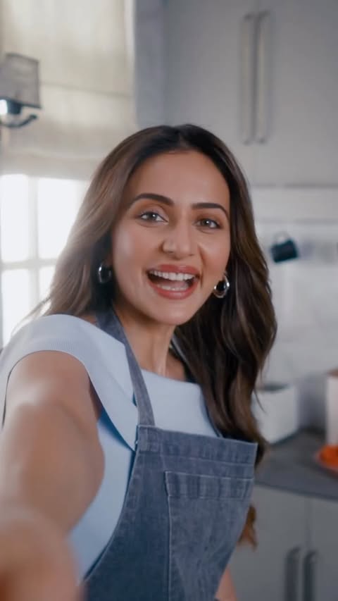 Instagram post by @rakulpreet for Vivo. Caption reads: [...] on stunning and sleek Passion Red....