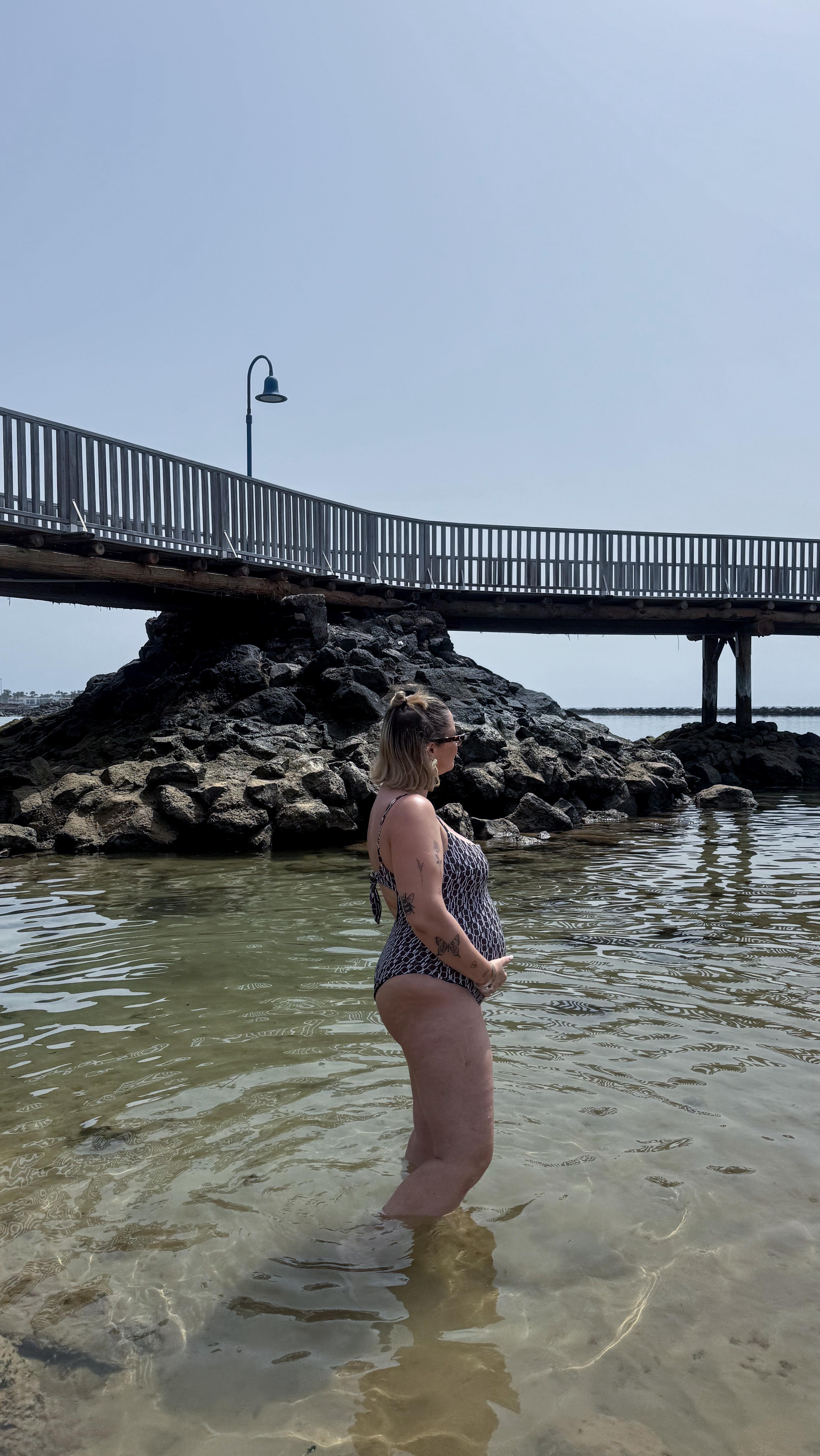 Instagram post by @gracesurguy for WAT THE BRAND. Caption reads: [...] his matching swimsuit & sarong from....