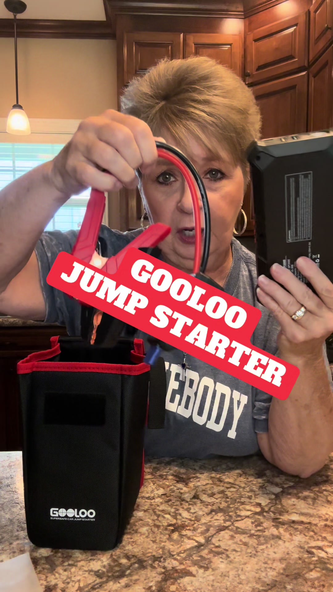 TikTok post by @sandrakword for GOOLOO Deutschland. Caption reads: #jumpstarter #auto #deadbattery #booster....