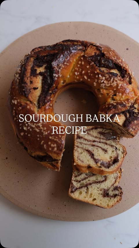 Instagram post by @sourdough_explained for Ooni. Caption reads: Getting festive with this sourdough babka....