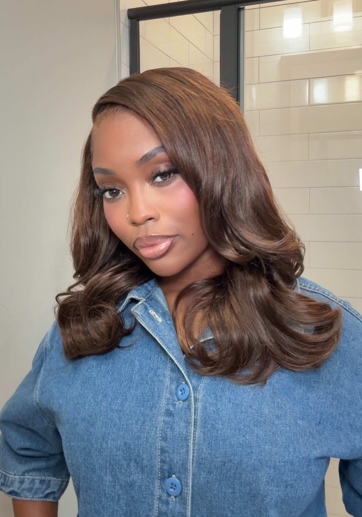 TikTok post by @jaelyndae for WestKissHair. Caption reads: The brown is so tea!😍 @westkisswig 🤎.