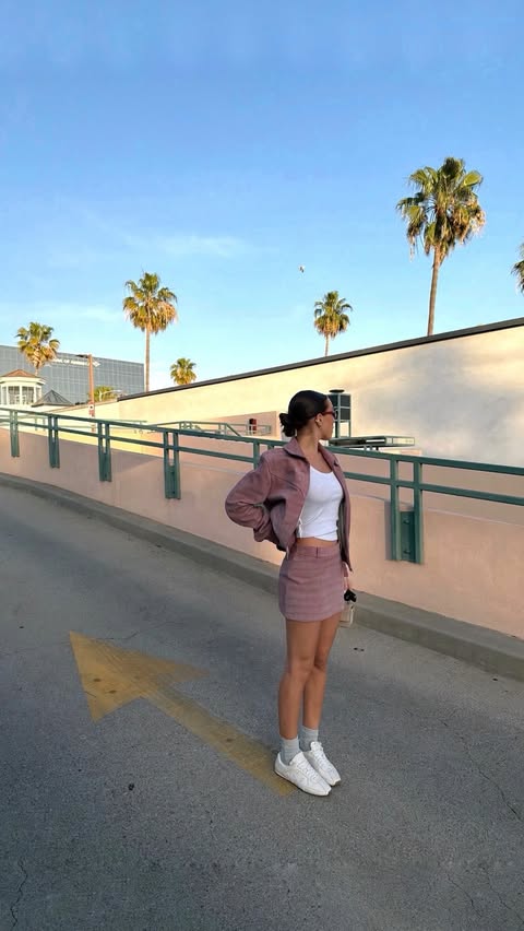 Instagram post by @ginevramavilla for AMIRI. Caption reads: on a hot girl walk 🌴💋 // @amiri.