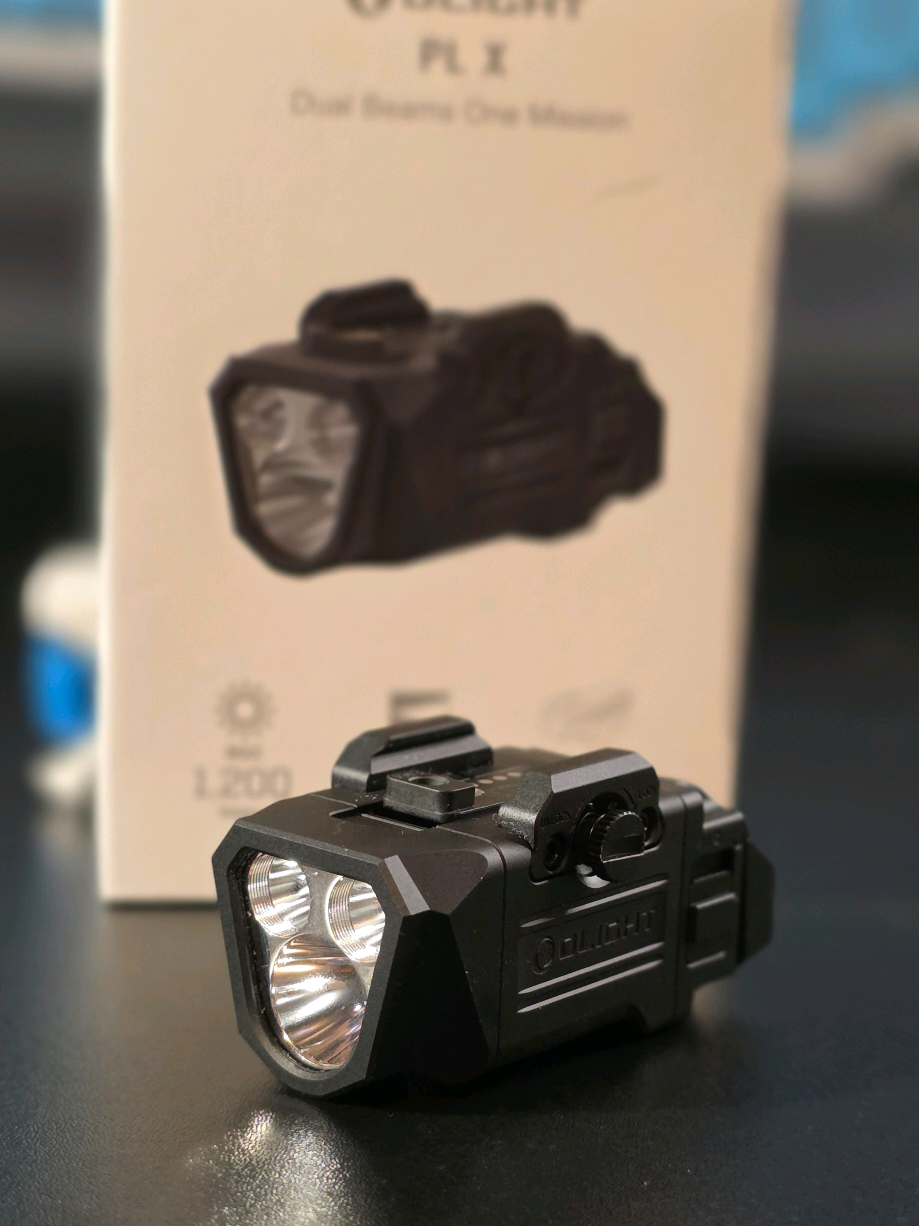 TikTok post by @tooladdictedgreasemonkey for Olight. Caption reads: @OLIGHT brand new PL X weapon light! I [...].