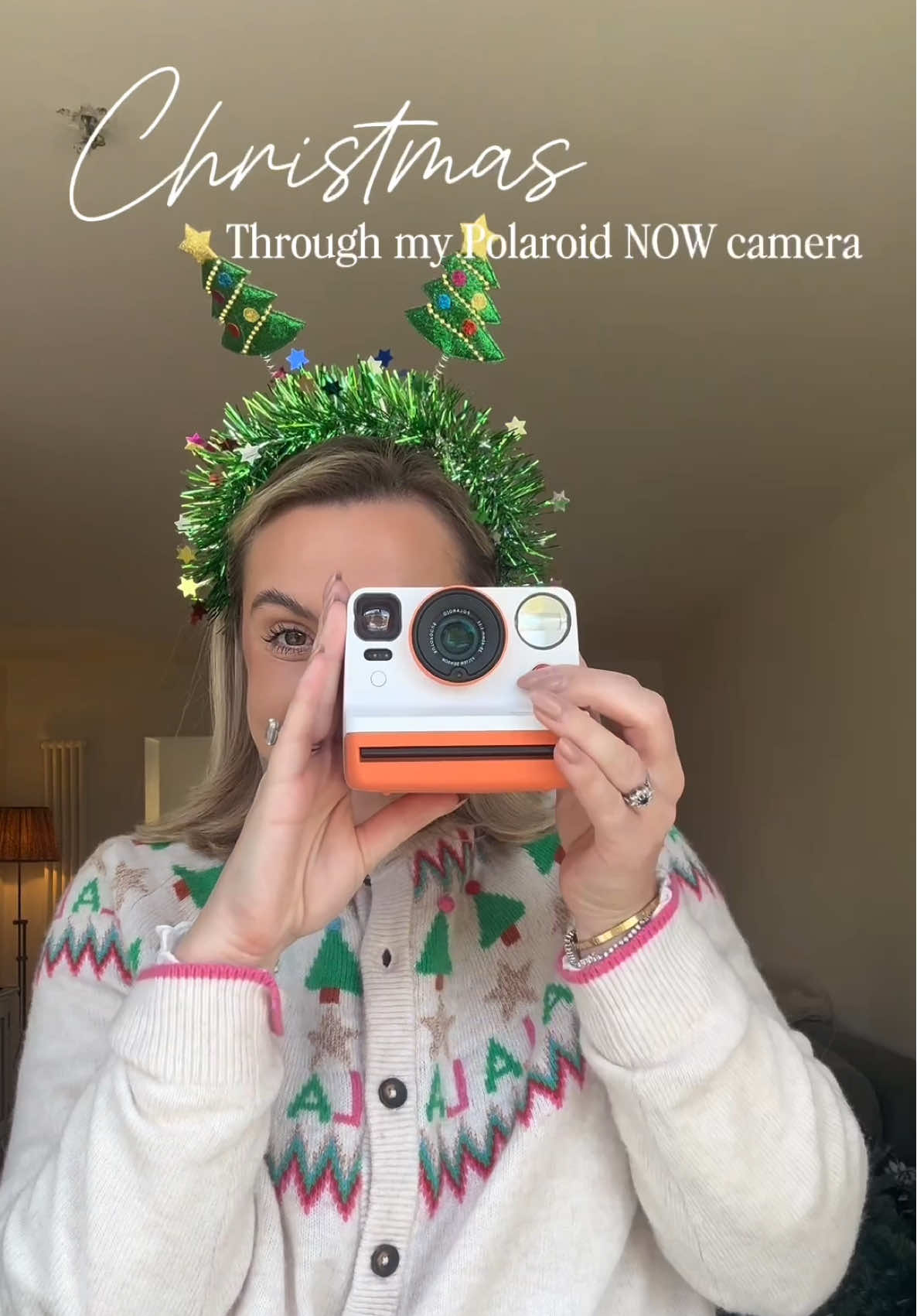 TikTok post by @mummysflippinhouse for Polaroid. Caption reads: [...] y’all! The tree is up and we used our....