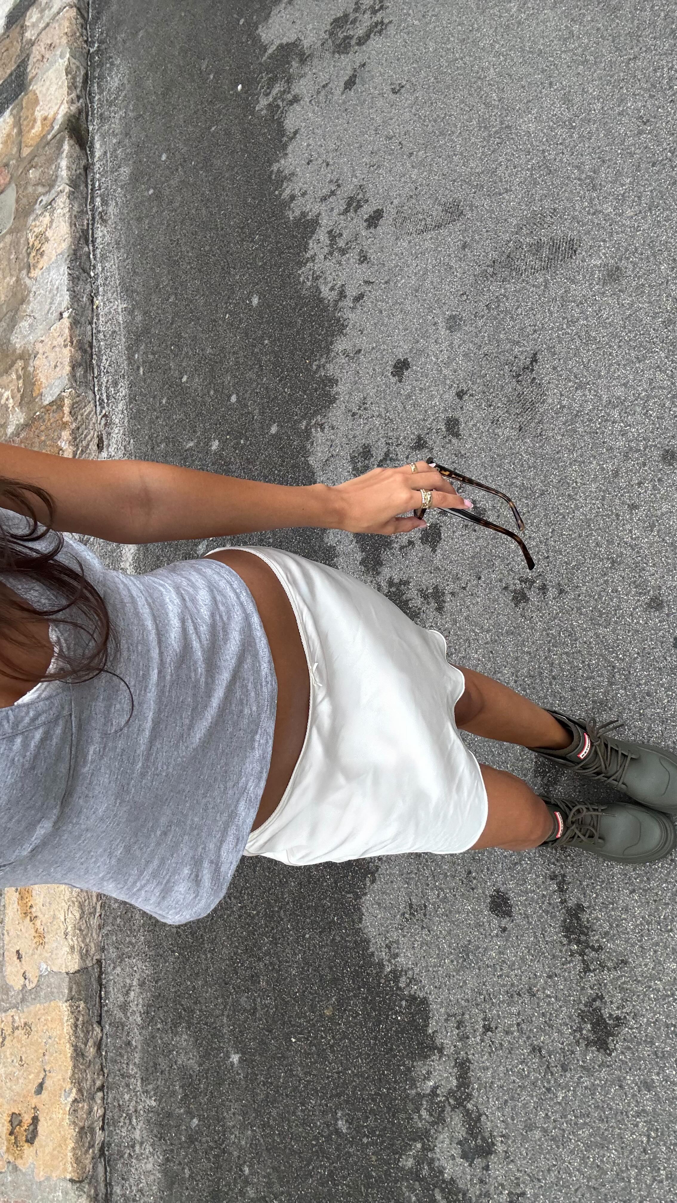 Instagram post by @ainaratorneg for Hunter Boots. Caption reads: boot season… but make it summer @hunterboots #ad.