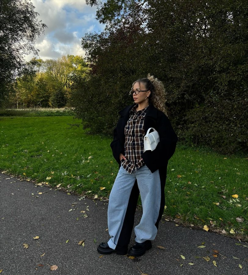 Instagram post by @laura_hussein for Buffalo. Caption reads: [...] on a rainy day ✨ Stepping out with....