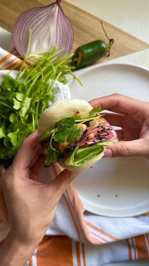 Instagram post by @christinatrinh_eats for Amylu Foods. Caption reads: These Holiday Bao Buns are the perfect appetizers....