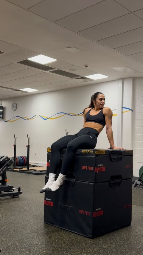 Instagram post by @exercisewithellie for Under Armour. Caption reads: [...] Get yours today at @sportsdirectuk....