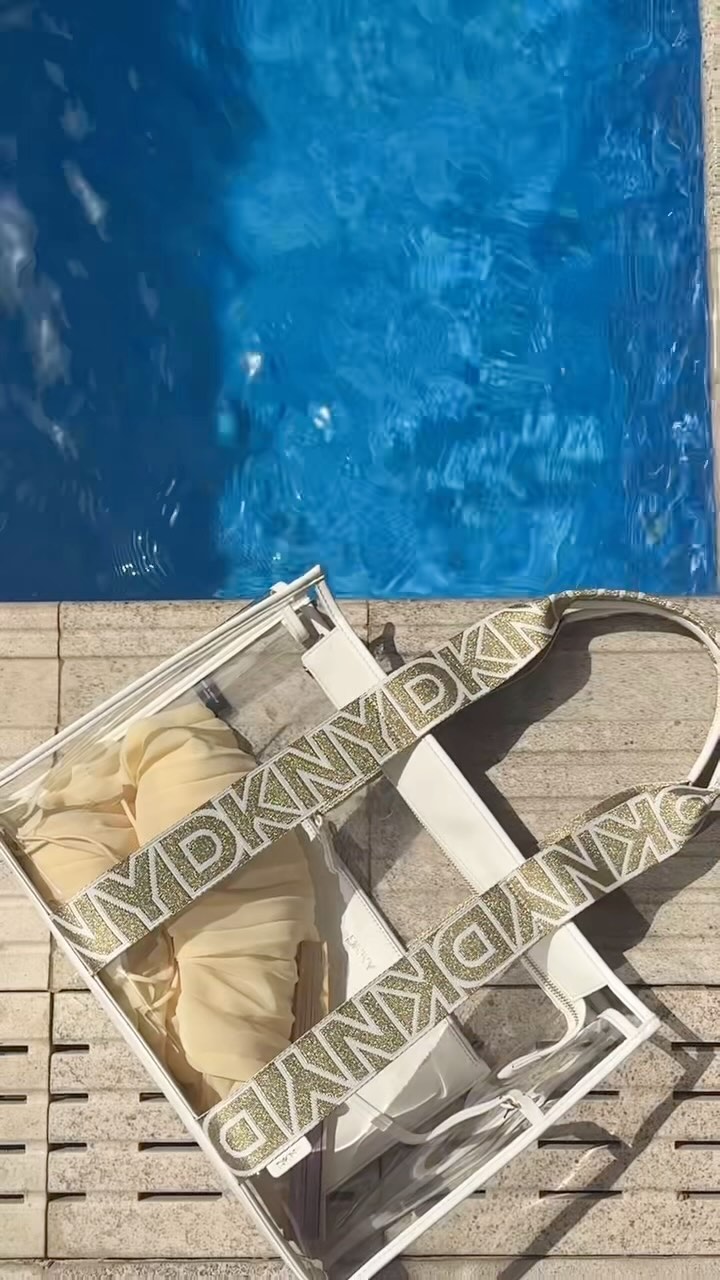 Instagram post by @ruba.tursun for DKNY. Caption reads: [...] with my essential bag from @dkny 
@dkny.me....