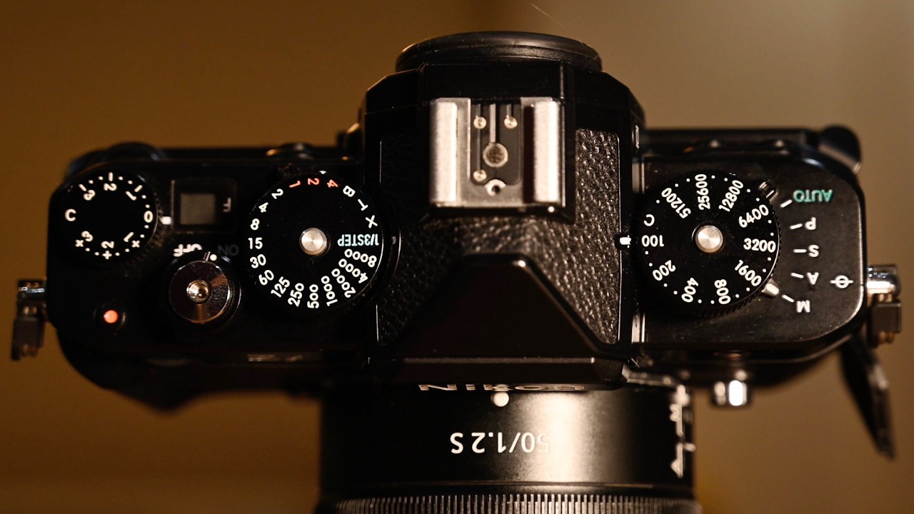 YouTube post by @mattgranger for B&H Photo Video. Caption reads: Nikon's Coolest Camera just got a major update.