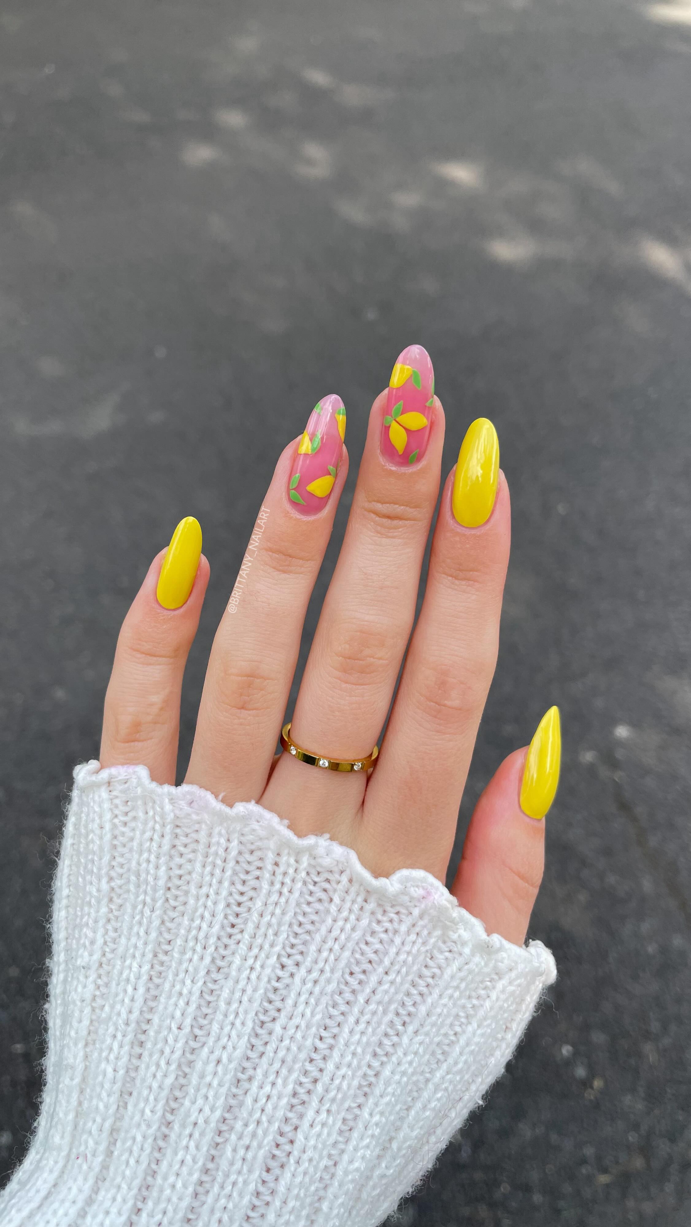 Instagram post by @brittany_nailart for Essie. Caption reads: #AD | nails that make you want to hop on a plane....