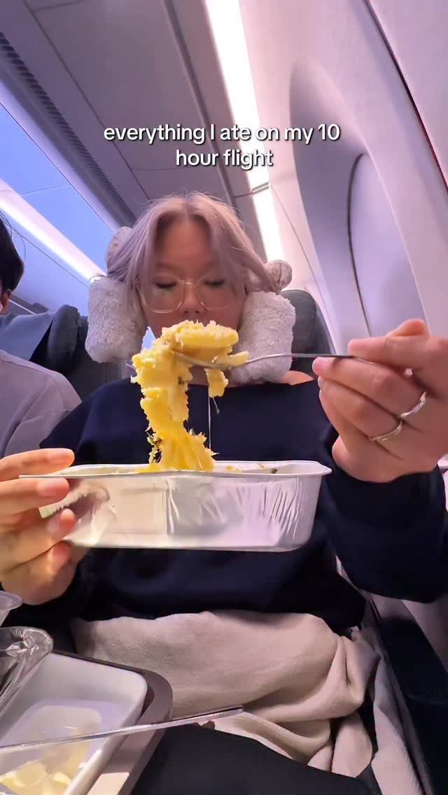 Instagram post by @aimschia for Cathay Pacific. Caption reads: everything i ate on my 10 hour flight from perth....