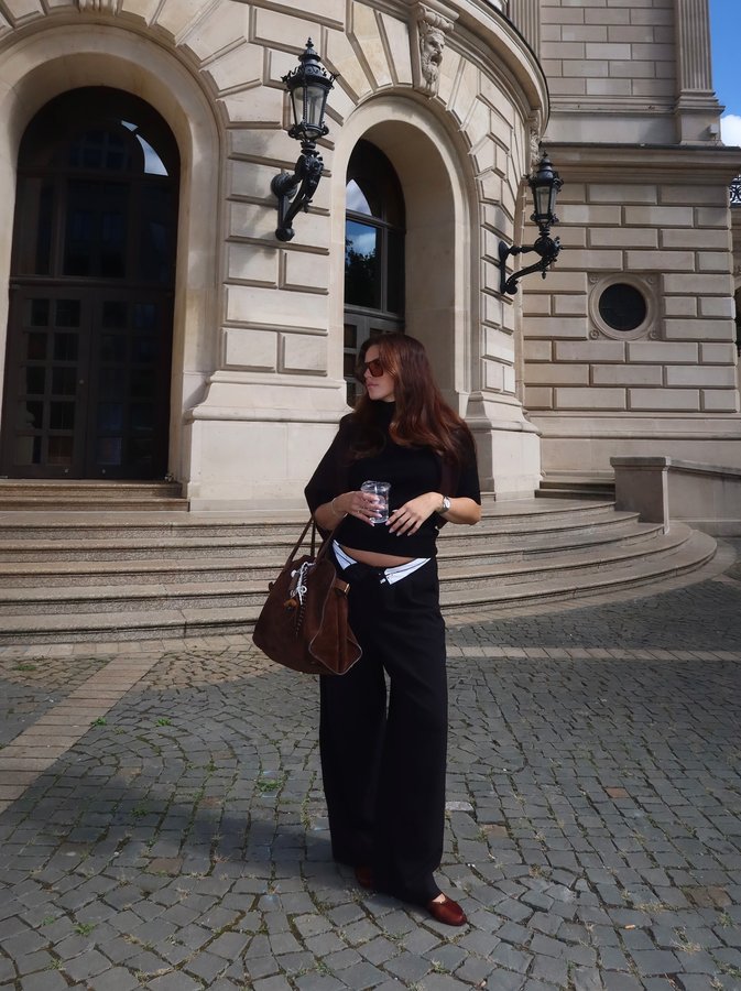 Instagram post by @clarissa__neumann for The Row. Caption reads: Starting the transitional look era 🌞🍂 *Werbung. ....