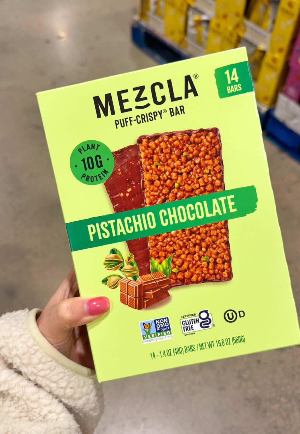 TikTok post by @alwaysbemyfoodie for Mezcla. Caption reads: ✨COSTCO FINDS✨ The @Eat Mezcla Pistachio Chocolate....