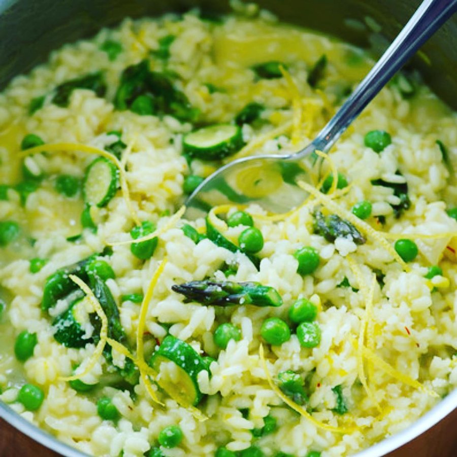 Instagram post by @cristinacooks for NYT Cooking. Caption reads: Creamy Risotto made with fresh garden peas and....