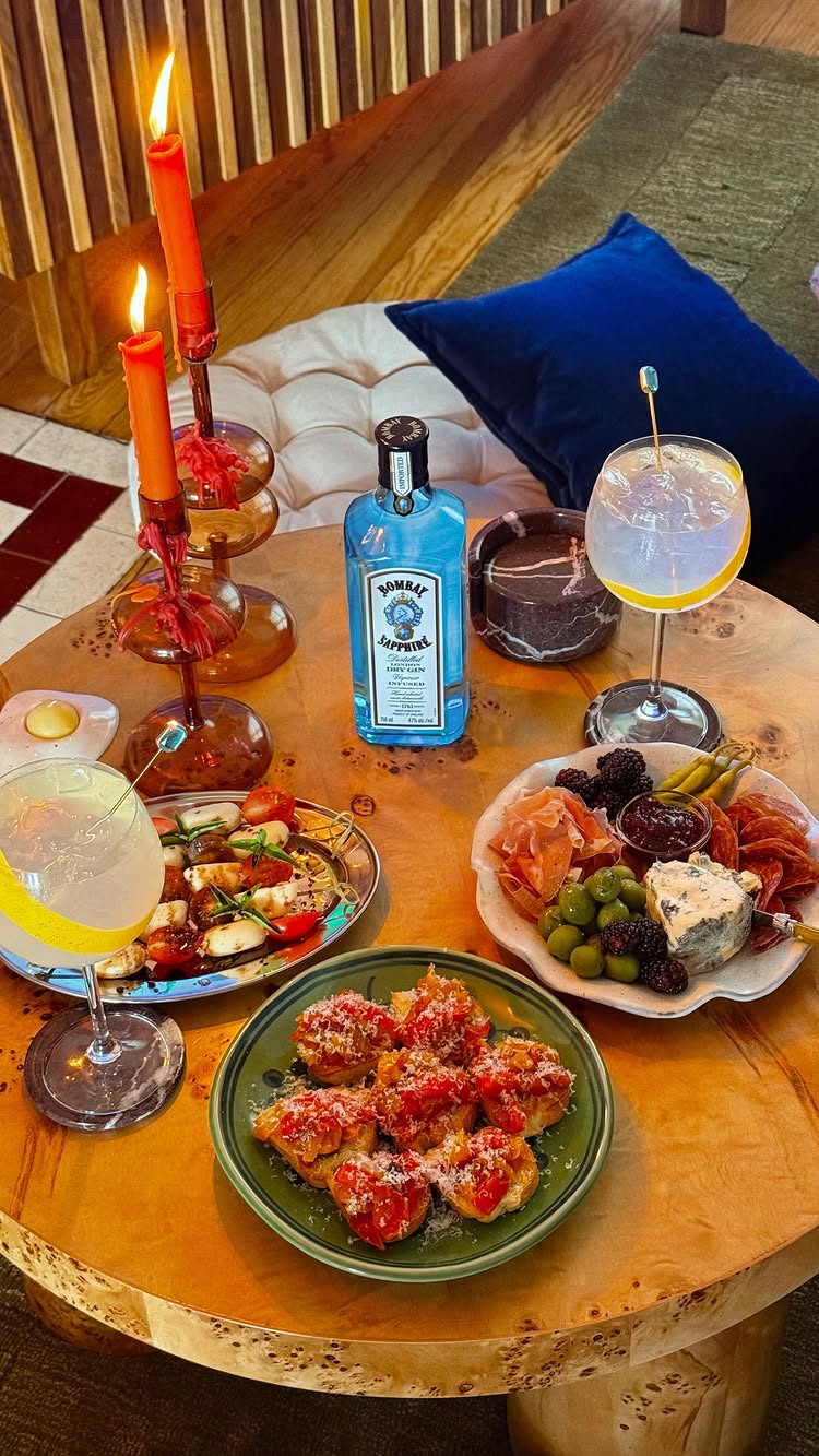 Instagram post by @drinksbyevie for Bombay Sapphire. Caption reads: Squeezing out the last sips of summer, indoors or....