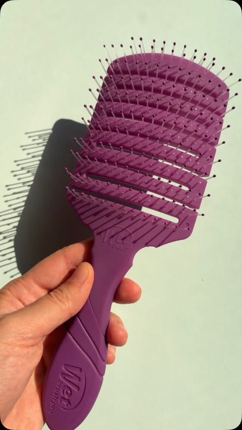 Instagram post by @espressoandmakeup for Wet Brush. Caption reads: [...] with the postpartum stank iykyk) 🔮....