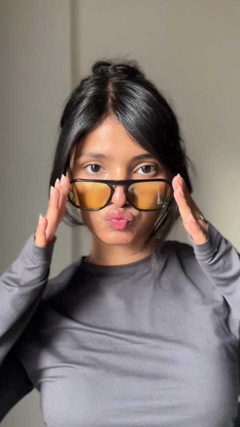 Instagram post by @naina_uttam for John Jacobs Eyewear. Caption reads: I have way too many glasses for a person with....