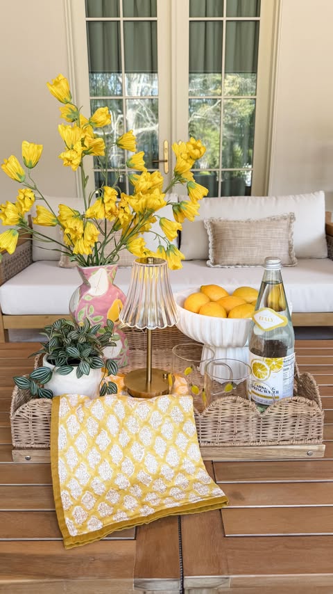 Instagram post by @ashleymariesavage for World Market. Caption reads: [...] in hand, and soaking it all in 🍋🌿....