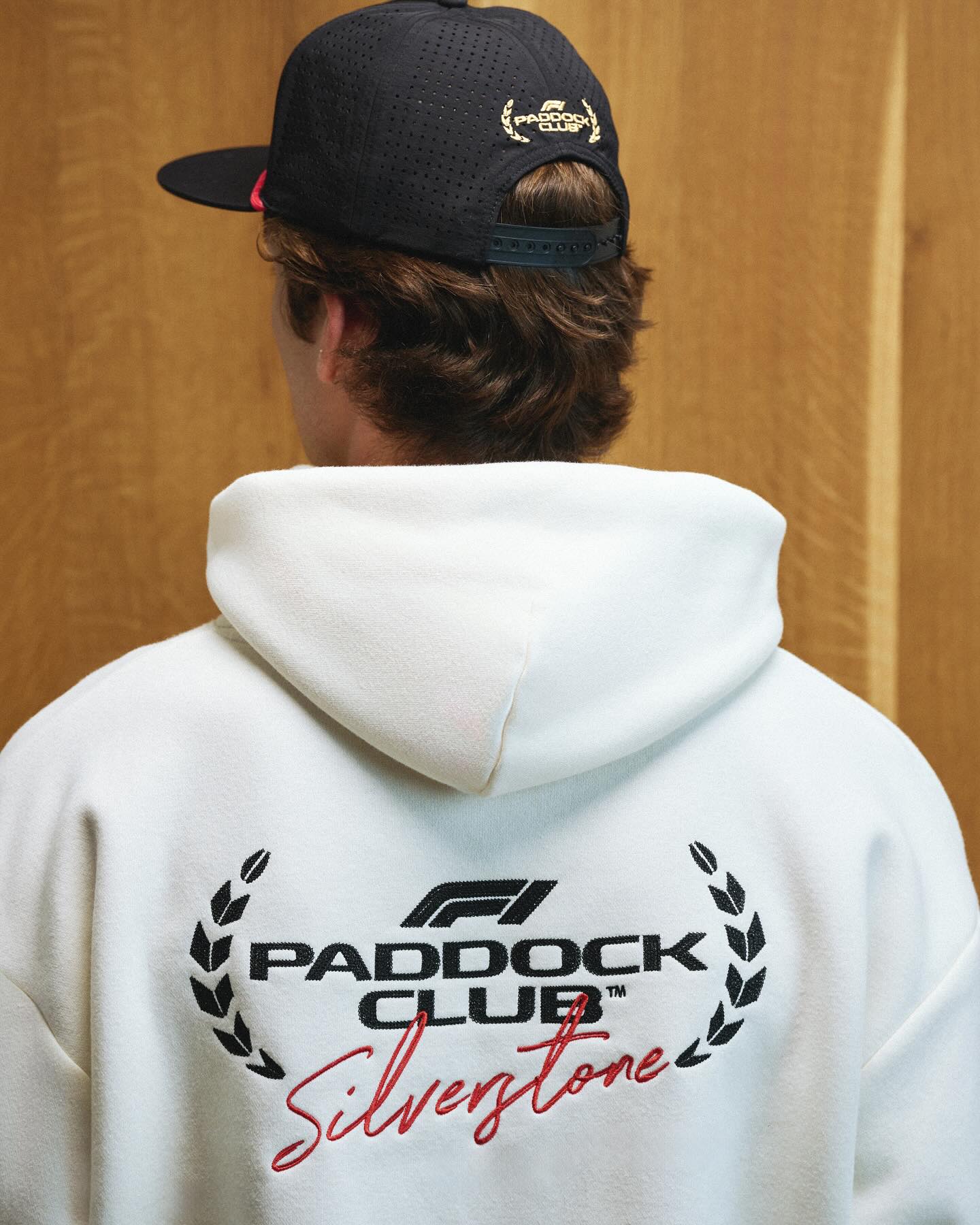 Instagram post by @f1paddockclub for Selfridges. Caption reads: Introducing the F1 Paddock Club collection: where....