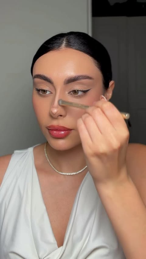 Instagram post by @atosaagha for Make Up For Ever. Caption reads: This is how I contour for a lifted nose without....