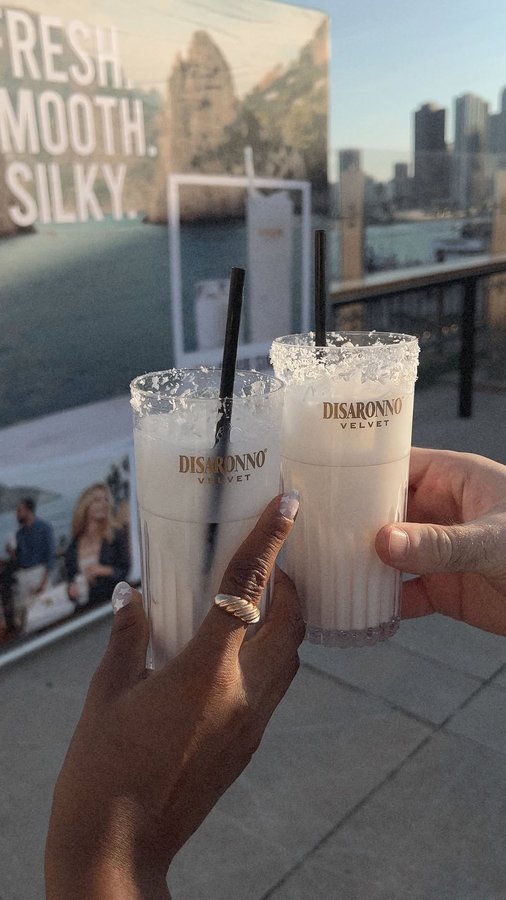 Instagram post by @iamstherfaned for Disaronno. Caption reads: La dolce Vita ☀️ @disaronno_official  Velvet....